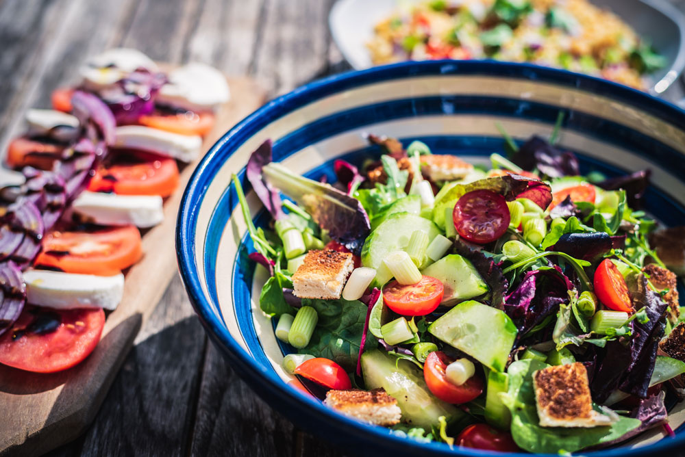 bowl with oriental style vegetable salad, top view