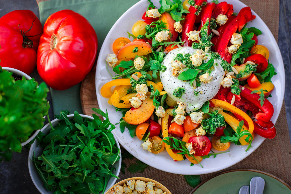 chili salad plate with some ingredients on the side, top view